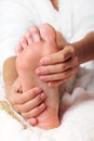 Woman massaging his feet Royalty Free Stock Photo
