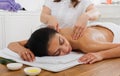 Woman massagist make body massage in spa wellness center