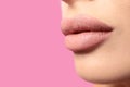 Woman with matte lipstick on pink background. Space for text Royalty Free Stock Photo