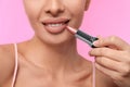 Woman with matte lipstick on pink background Royalty Free Stock Photo