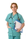 Woman md emergency doctor or nurse posing serious with stethoscope