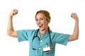 Woman md emergency doctor or nurse posing smiling cheerful with stethoscope showing biceps Royalty Free Stock Photo