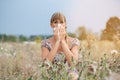 Woman in meadow snorts in handkerchief Royalty Free Stock Photo