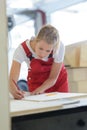 woman measure wood plank before saw Royalty Free Stock Photo