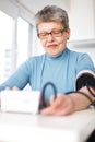 Woman measured her blood pressure Royalty Free Stock Photo