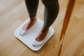 Woman Measuring Body Weight At Home. weight loss control Royalty Free Stock Photo