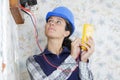 Woman measuring electrical current Royalty Free Stock Photo