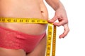 Woman measuring fat abdomen. Royalty Free Stock Photo