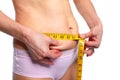 Woman measuring fat abdomen. Royalty Free Stock Photo