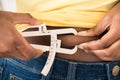 Woman Measuring Fats With Caliper Royalty Free Stock Photo