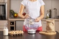 Woman measuring flour