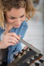 woman measuring guitar headstock Royalty Free Stock Photo