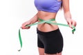 Woman measuring her thin waist with a tape measure, close up Royalty Free Stock Photo