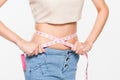 Close Up Woman measuring her waistline with measure line Royalty Free Stock Photo