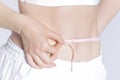 Woman measuring her waistline . Perfect Slim Body Royalty Free Stock Photo