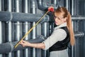 Woman measuring pipes distance Royalty Free Stock Photo