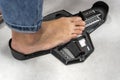 woman Measuring Shoe Size in storage. device determining length foot