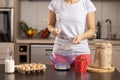 Woman measuring and sieving flour Royalty Free Stock Photo