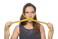 Woman with measuring tape around her mouth on white background. Diet concept Royalty Free Stock Photo