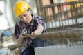 Woman measuring wooden board with tape measure Royalty Free Stock Photo