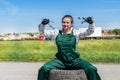 Woman mechanic posing with spanners and tyres Royalty Free Stock Photo