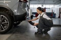 Woman mechanic testing car traffic fumes emission Royalty Free Stock Photo