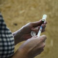 Woman medic opens the vaccine and gaining a syringe for injection. vaccination against dangerous diseases Royalty Free Stock Photo