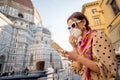 Woman in medical mask at cafe near Duomo cathedral in Florence Royalty Free Stock Photo