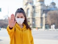 Woman in medical mask, making stop it there