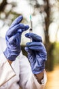 Doctor holding medical syringe Royalty Free Stock Photo