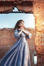 Woman in medieval dress praying Royalty Free Stock Photo