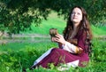 Woman in medieval suit with old casket