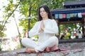 Woman meditates on nature background. Royalty Free Stock Photo