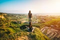 Woman meditates on the top of the mountain. Soul leaves body. Mind and spirit