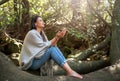 Woman meditating with her eyes closed in a forest Royalty Free Stock Photo