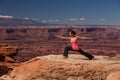 Woman meditating doing yoga in Canyonlands National park in Utah