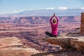 Woman meditating doing yoga in Canyonlands National park in Utah