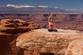 Woman meditating doing yoga in Canyonlands National park in Utah, USA