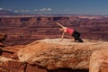 Woman meditating doing yoga in Canyonlands National park in Utah