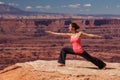 Woman meditating doing yoga in Canyonlands National park in Utah