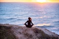 Woman meditating and doing youga at sunset Royalty Free Stock Photo