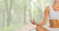 Woman Meditating in forest bright background Royalty Free Stock Photo