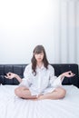 Woman meditating at her bedroom. concept for healthy