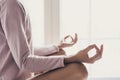 Woman meditating at home. Girl practicing yoga in yoga class