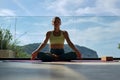 Woman meditating in Lotus pose