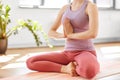 Woman meditating in lotus pose at yoga studio Royalty Free Stock Photo