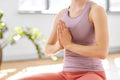 Woman meditating in lotus pose at yoga studio Royalty Free Stock Photo