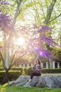 Woman meditating in a park