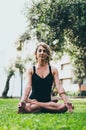 Woman Meditating And Practicing Yoga, Padmasana. Meditation On Sunny Autumn Day At Park. Workout Outdoor. Royalty Free Stock Photo