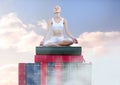 Woman meditating relaxing on Books stacked by sky